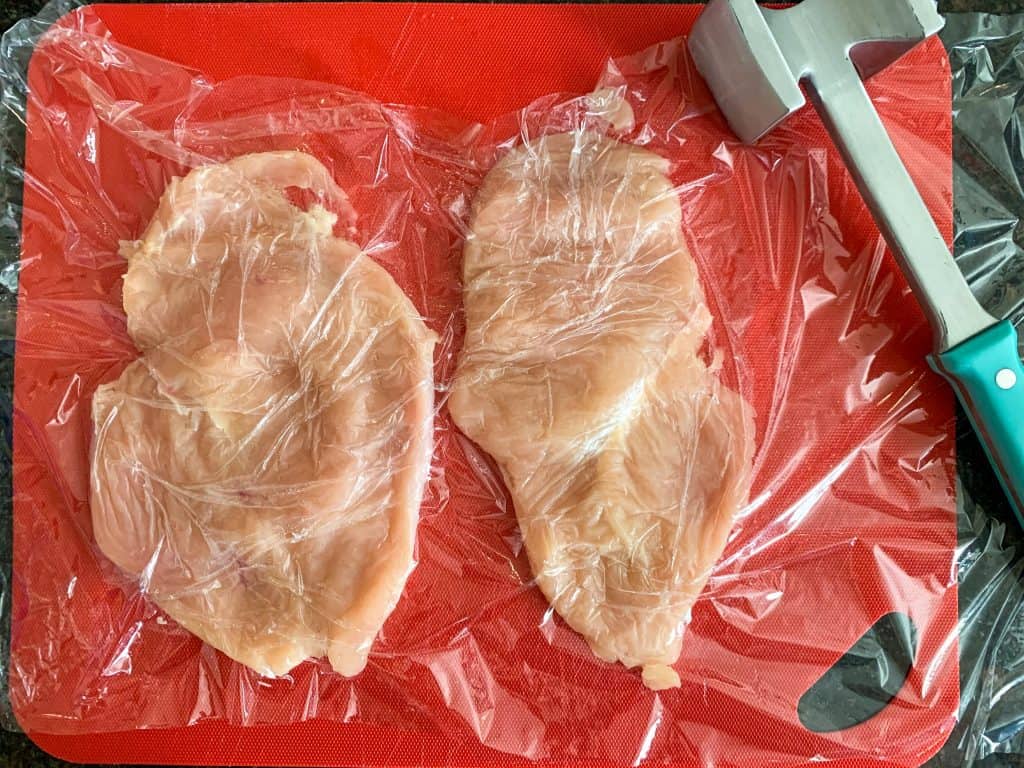 raw chicken on a cutting board