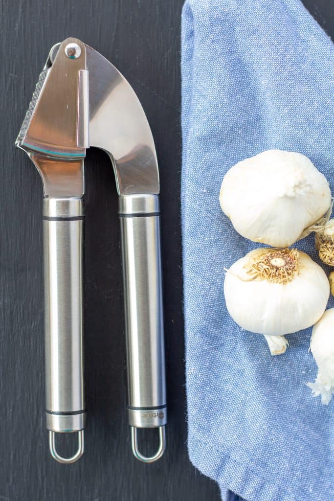 Why You Shouldn't Peel Your Garlic When You Use a Garlic Press